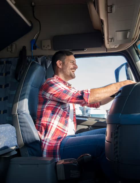 A man driving a truck