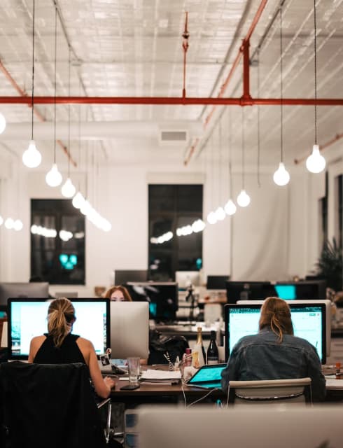 People working on their computers in an open space